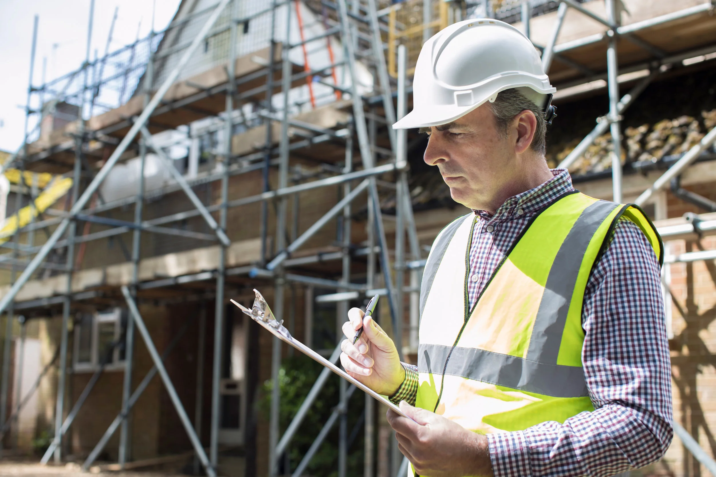 Man in hard hat with clipboard