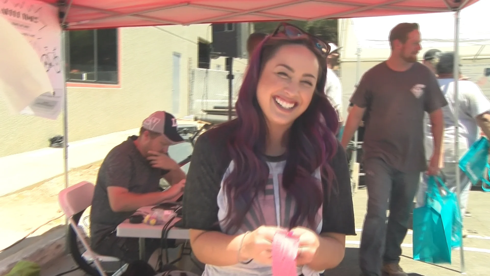 Jennilyn Magee smiling at the check-in booth.