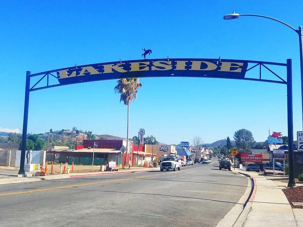 Image of the 30-foot high “Lakeside” sign spanning over the north end of Maine Avenue in Lakeside, CA.