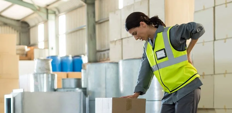 Injured employee working with hurt back.jpeg