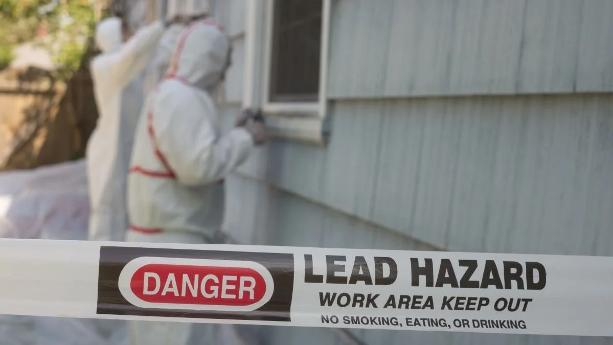 Lead Paint Hazard Workers Scraping Paint Off House.jpg