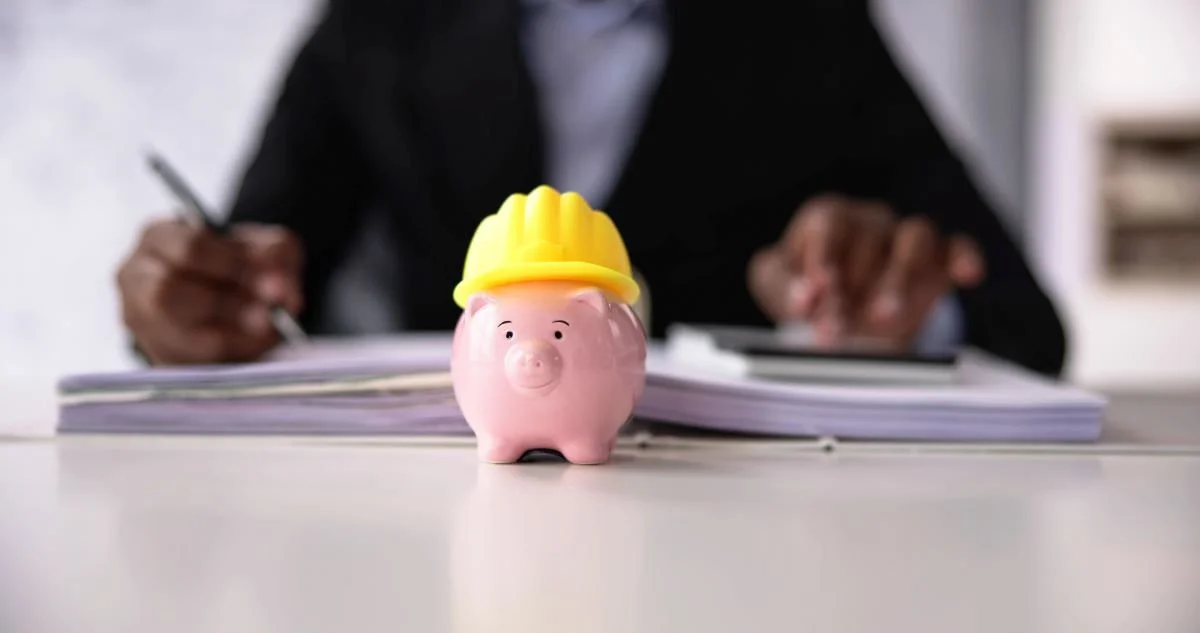 Piggy bank with construction hat.jpg