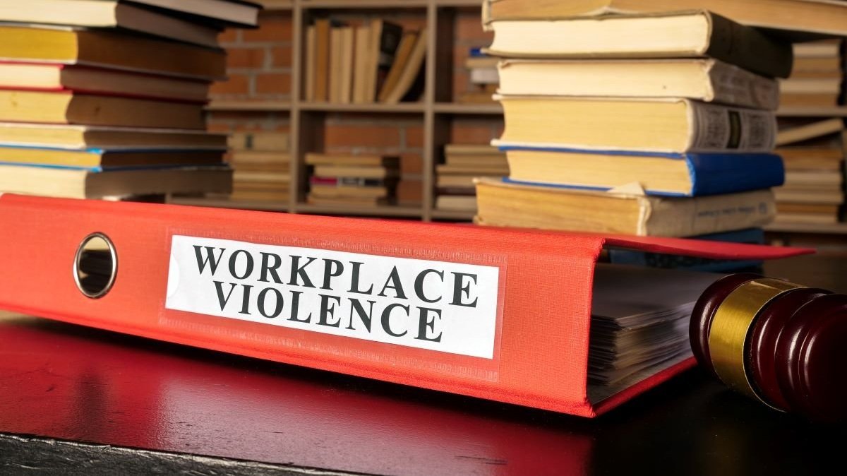 Documents about workplace violence in the court with books.jpg