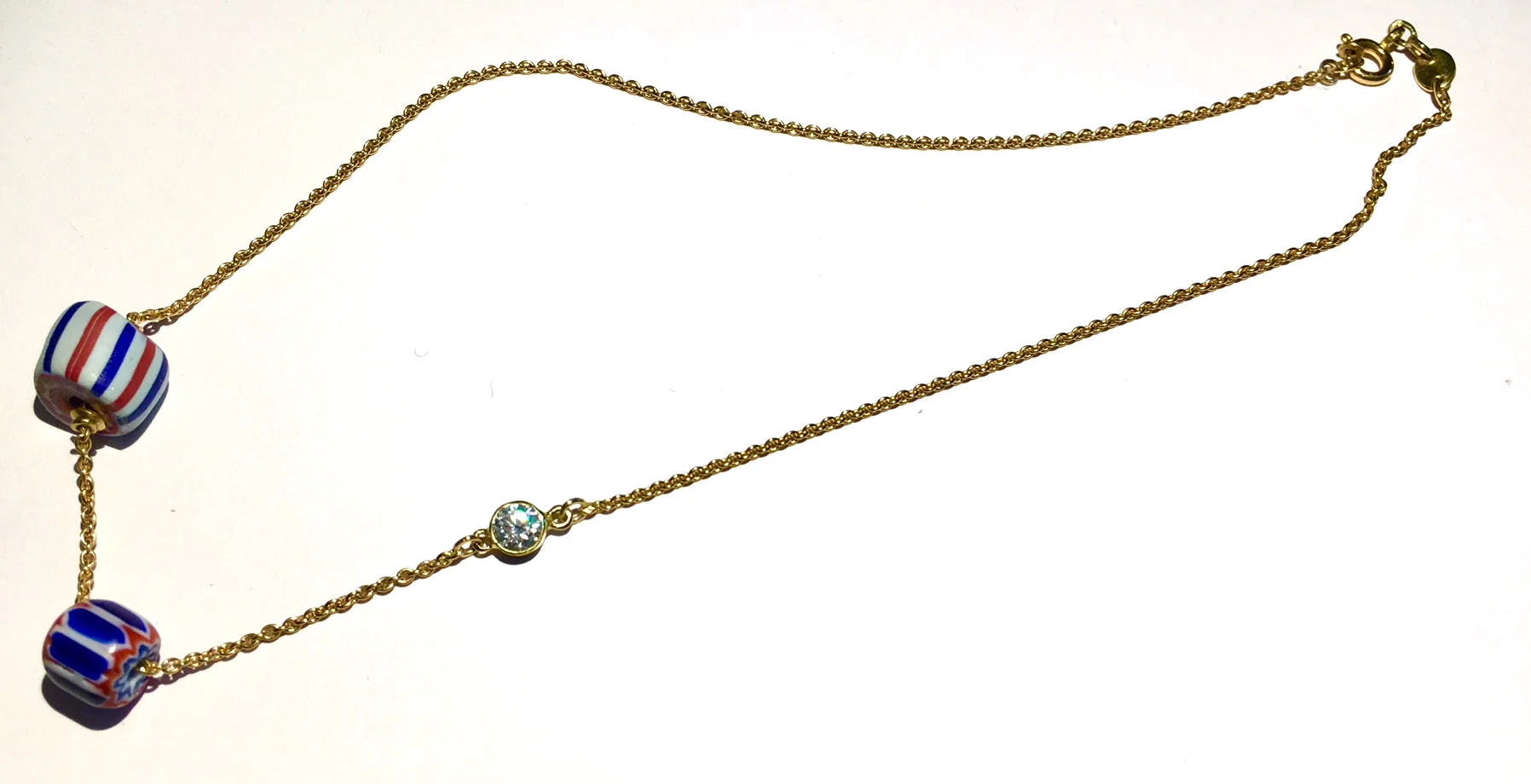 COLLIER FORCA OR JAUNE AVEC PERLE D'AFRIQUE ET BRILLANT
