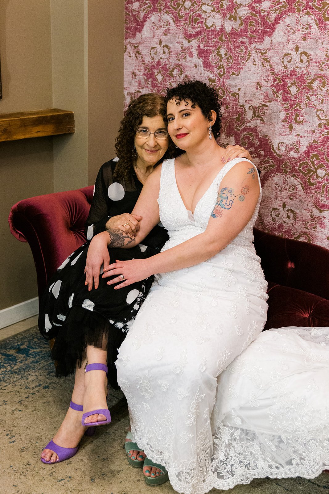  Photo of bride and mom In bridal suite after nontraditional Jewish and Venezuelan wedding ceremony at The Joinery Chicago an Industrial loft wedding venue In Logan Square. 