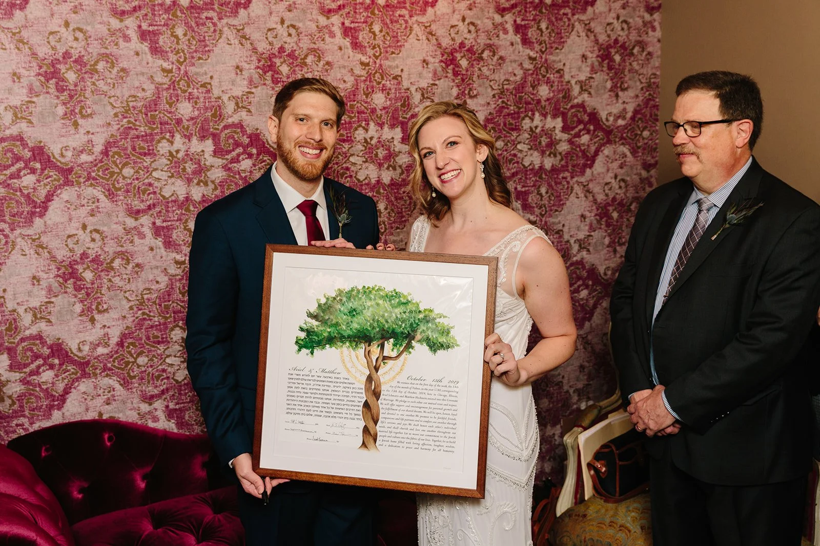 bride and groom with ketubah 