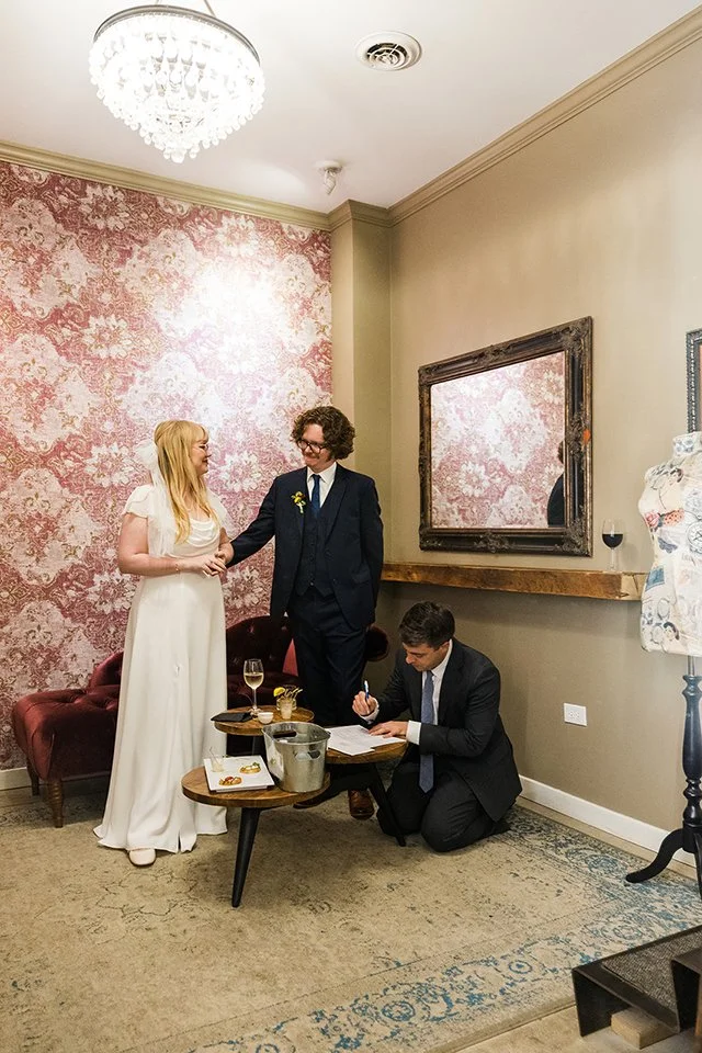 Signing marriage license at The Joinery