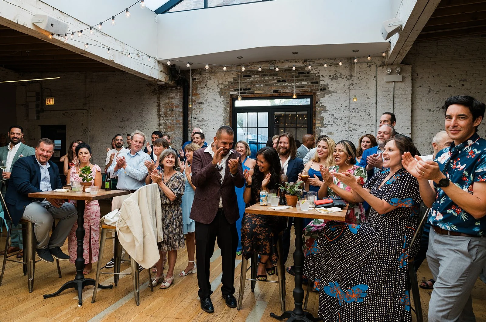 Guests clapping at wedding reception the joinery chicago 