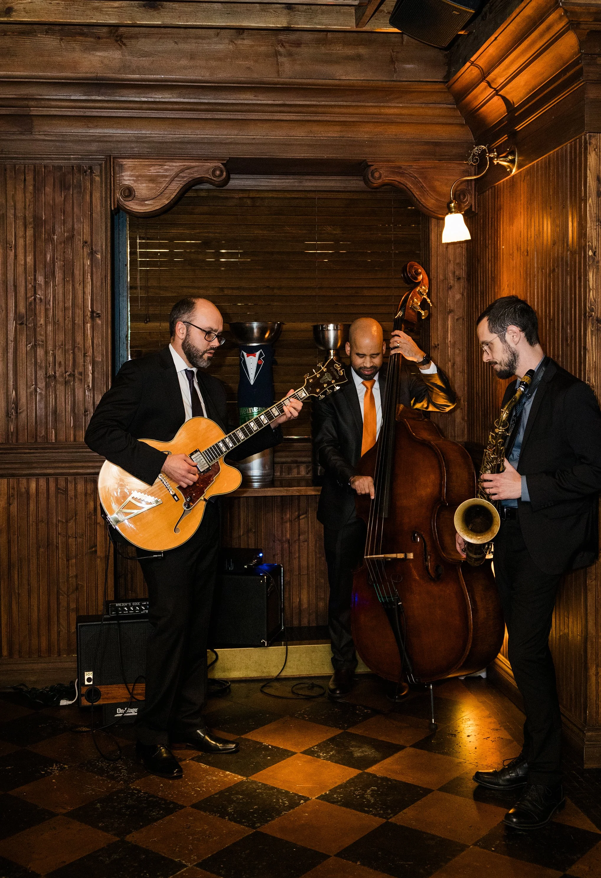 Band playing at gilt bar wedding