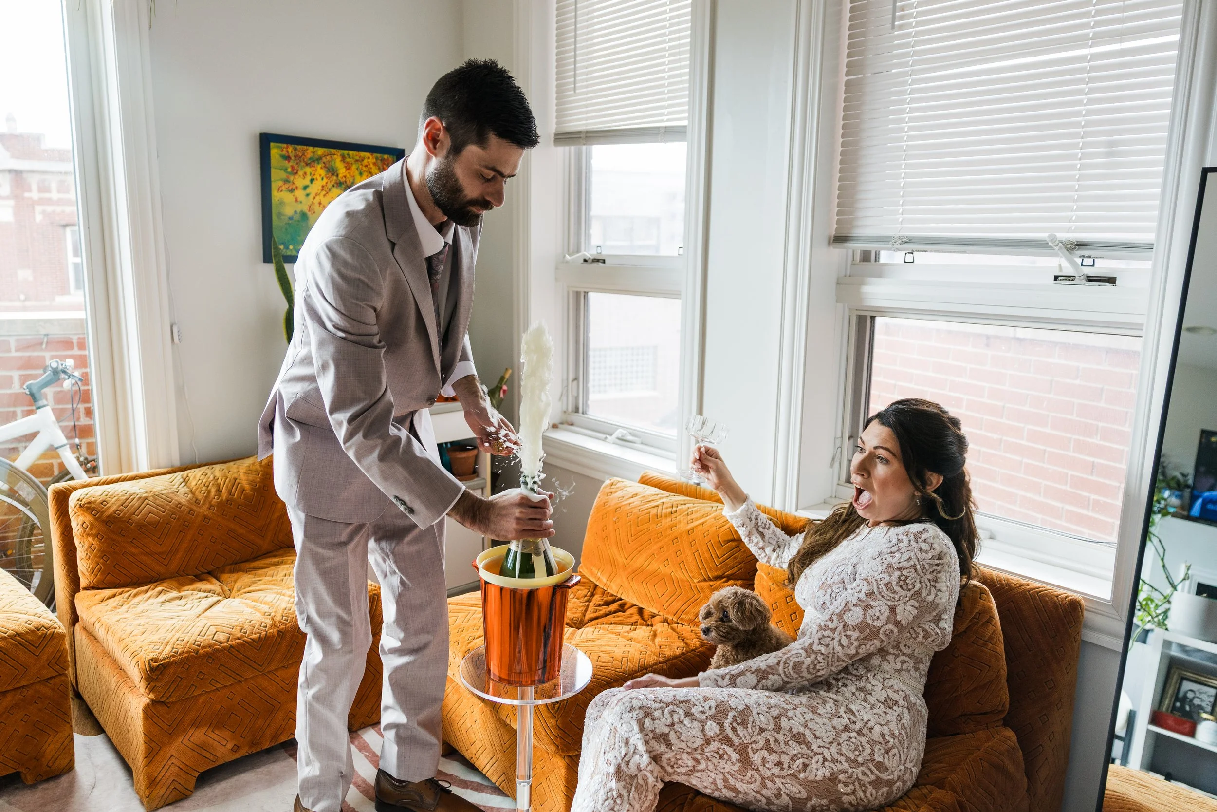 Nontraditional wedding candid Champagne pop