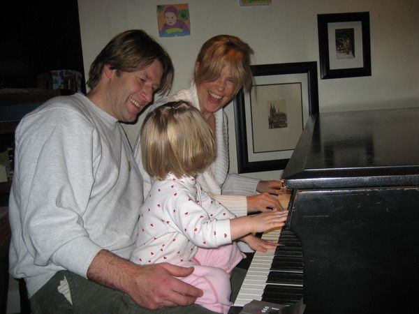 Mark, MB playing piano with child.jpg