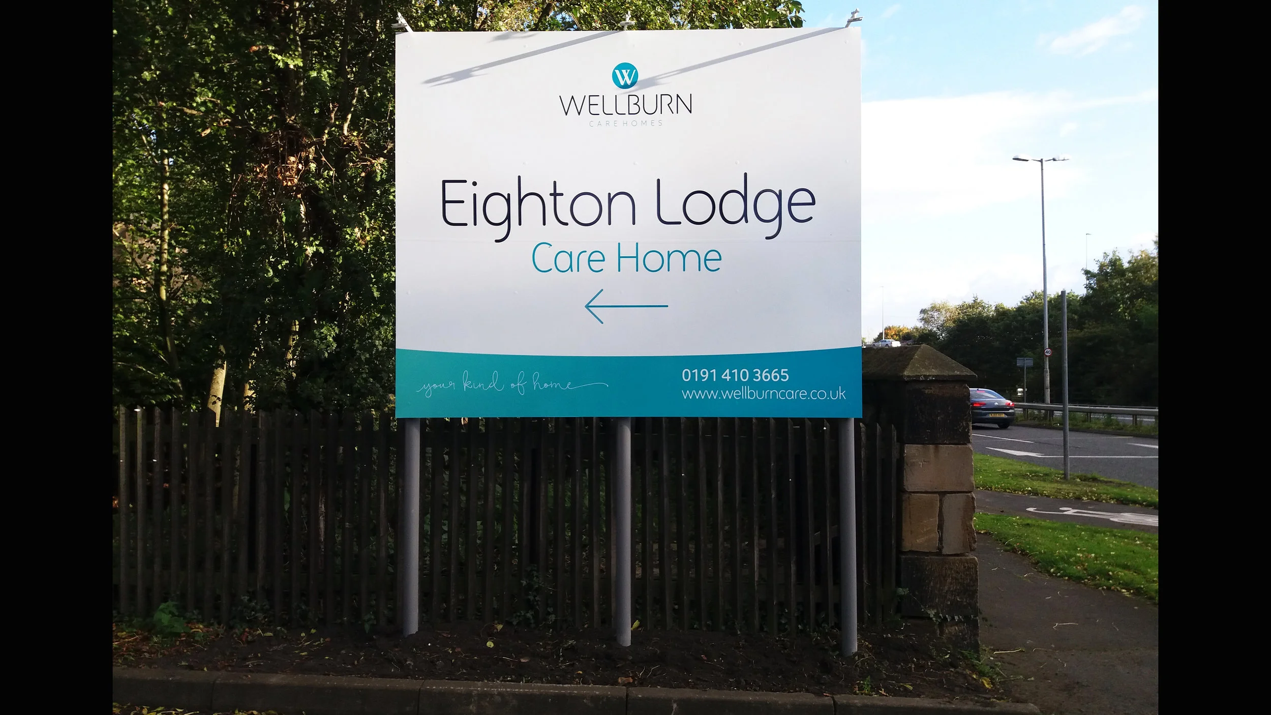 Large post mounted dibond sign with a trough light applied