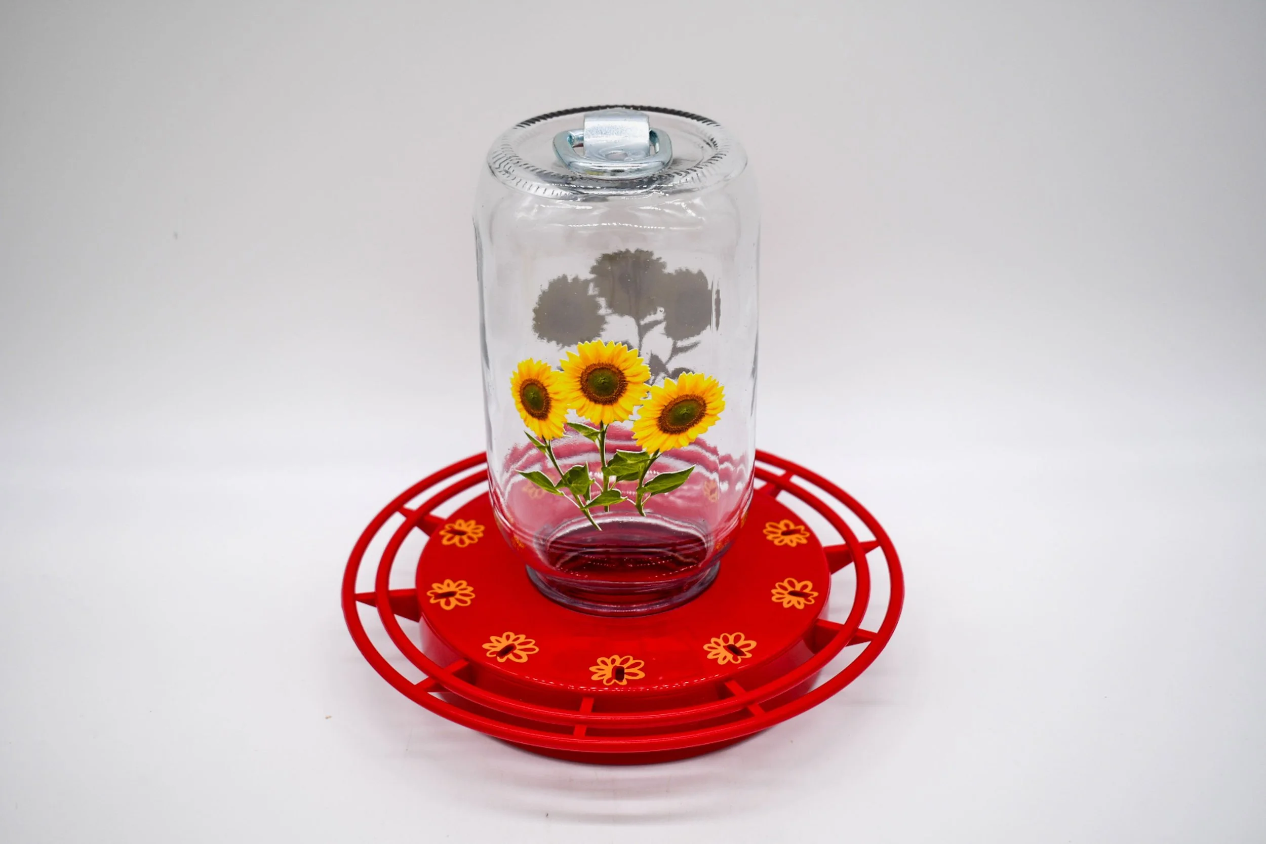 Sunflower 32 oz Mason jar installed on red Turbine hummingbird feeder base