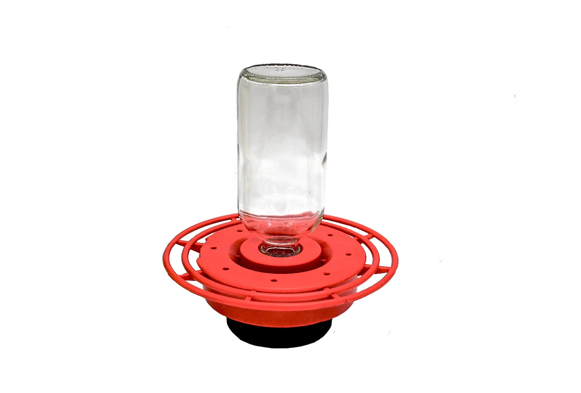 Clear bottle with feeder base and puck for mounting.
