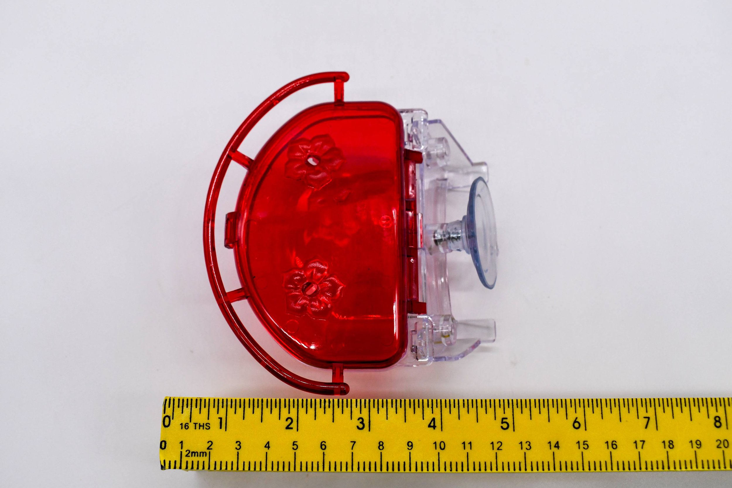 Top side profile of the Aspects The Gem 4 oz Window Hummingbird Feeder showing the mounting bracket, suction cup, and feeder depth with width measurement.
