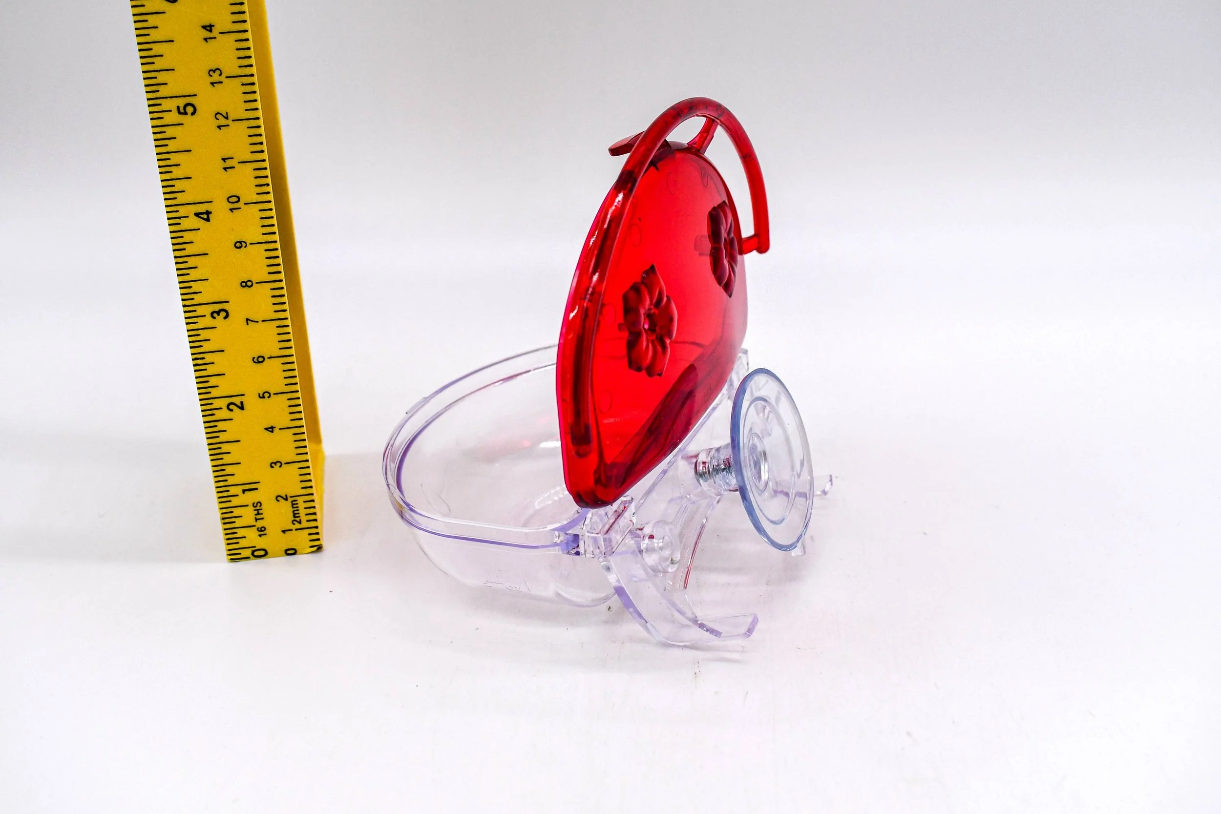 Side view of the Aspects The Gem 4 oz Window Hummingbird Feeder with the lid open, displaying the nectar reservoir, hinged cover, and suction cup mounting system.