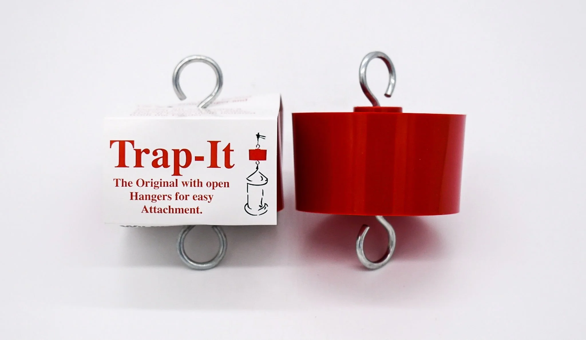 Red Wildlife Accessories Trap-It ant trap shown beside its product packaging.