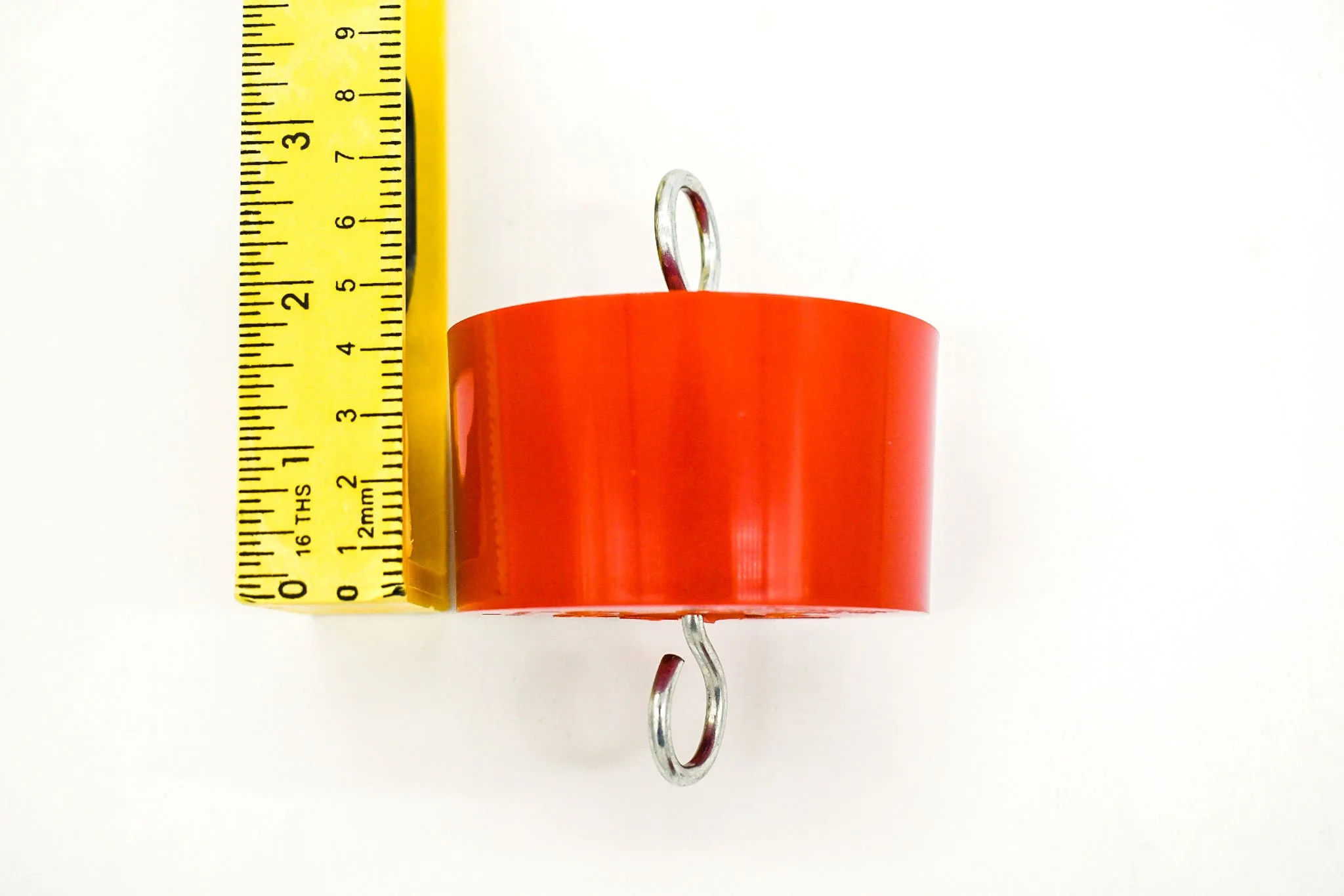 Measuring tape showing the approximate overall height of the red bird feeder ant trap.