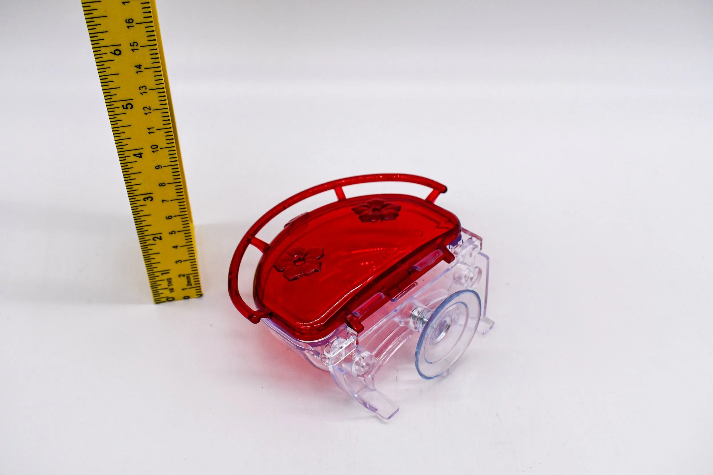 Rear side angle of the Aspects The Gem 4 oz Window Hummingbird Feeder highlighting the clear mounting bracket, suction cup, and feeder profile with height measurement.