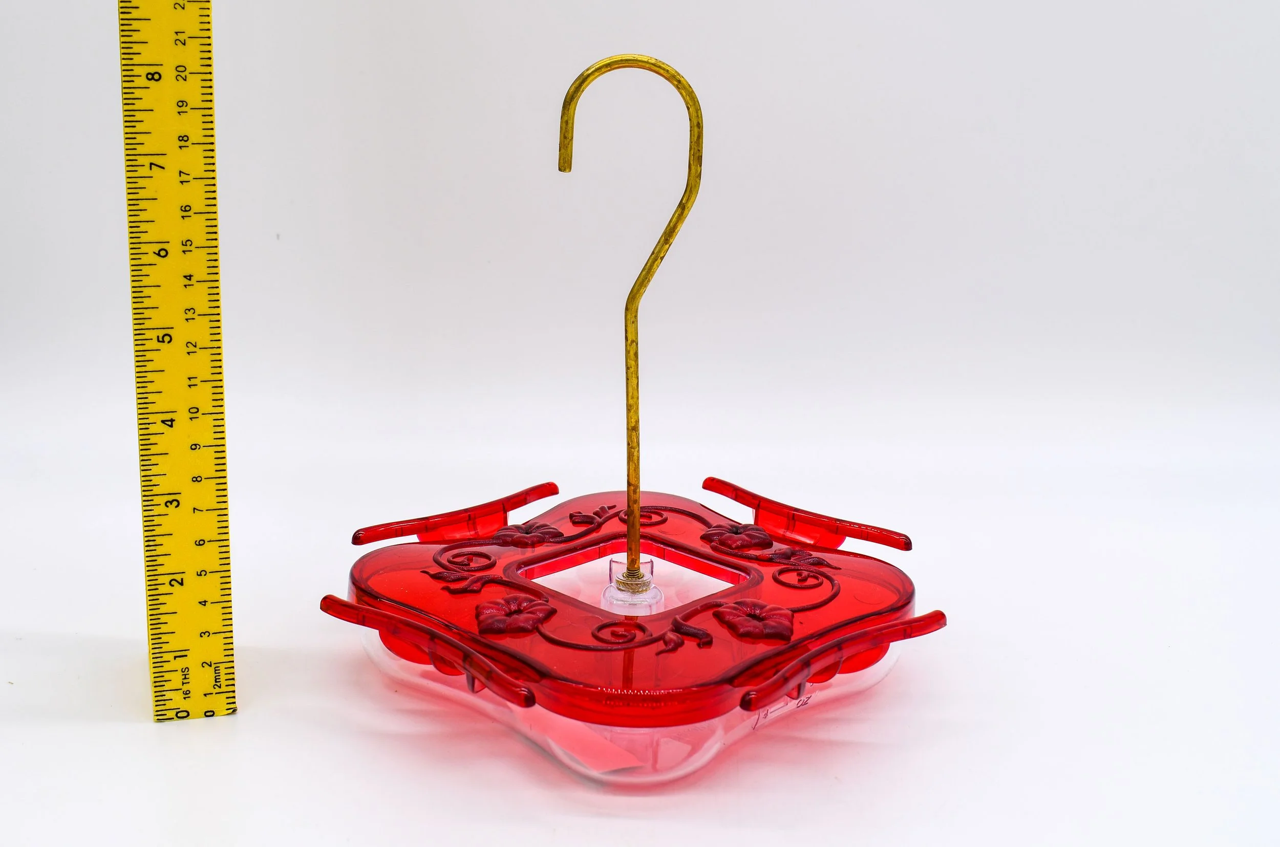 Side view of Aspects HighView Square 8 oz hummingbird feeder with brass rod and ruler showing size
