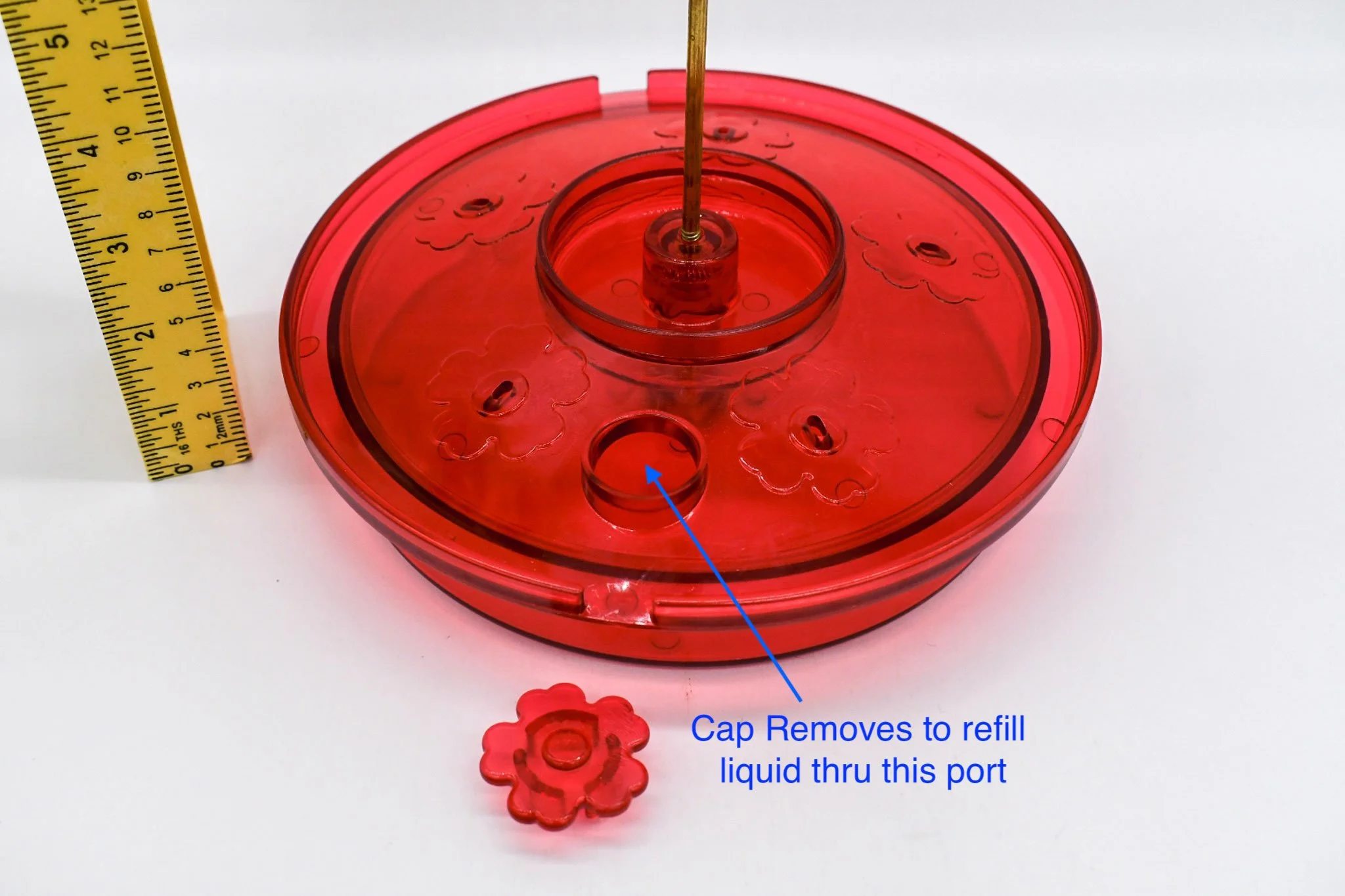 Close-up of the Hummingbird Haven feeder showing the removable top-fill cap and feeding area.