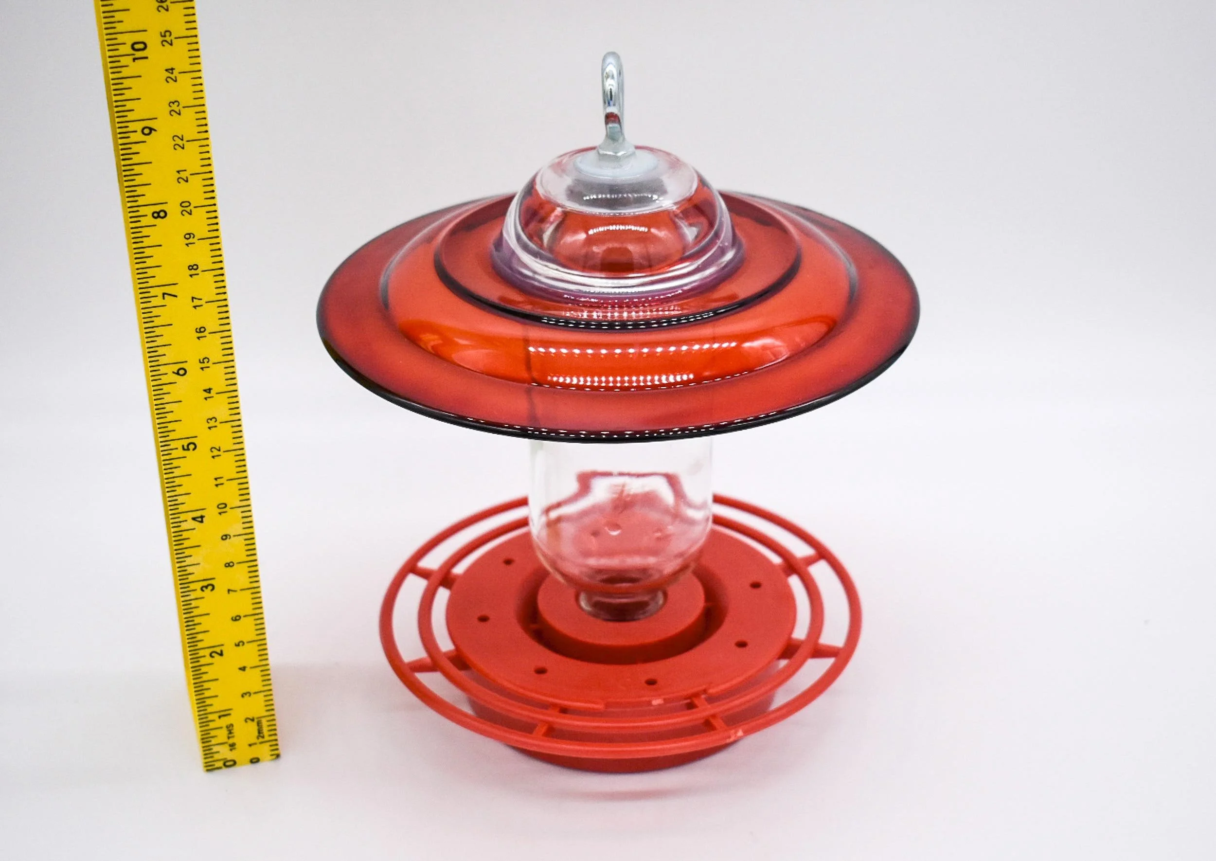 Angle view of Red Anchor Hocking Clear Hummingbird Feeder