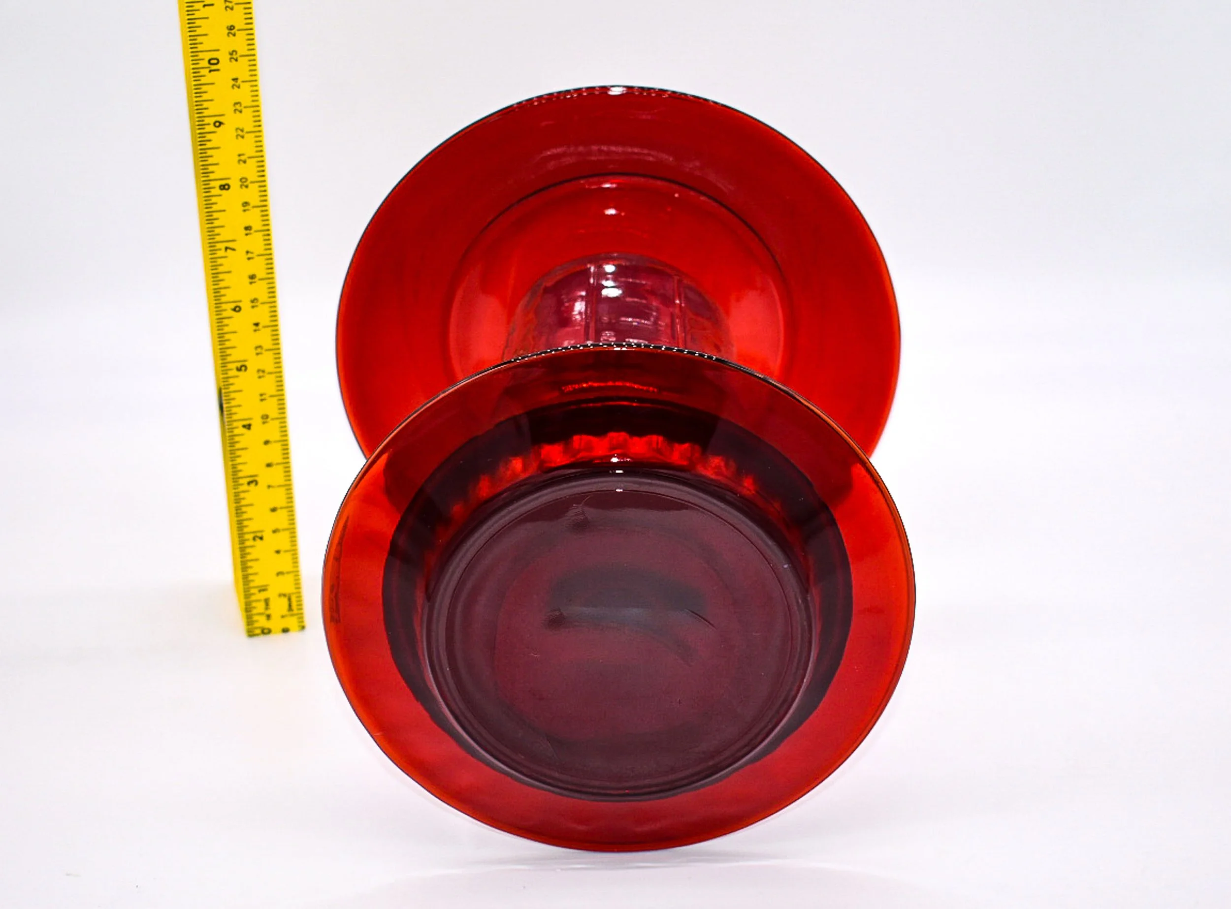 Red glass Mason jar bird feeder with ruler showing the diameter and construction of the upper rain guard and lower glass tray.