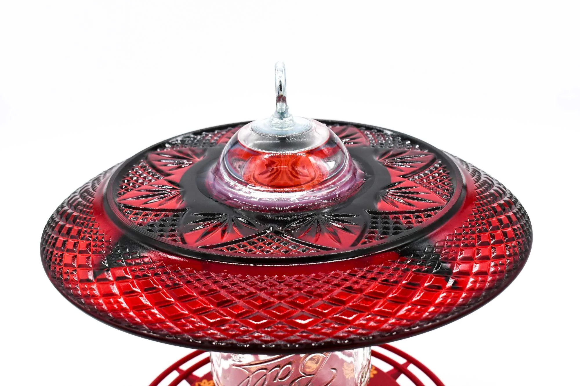 Close up view of Durand Red Plate with patterns