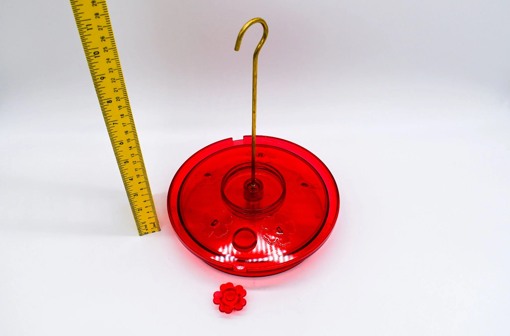 Two-piece Hummingbird Haven feeder opened to show the removable cover and nectar reservoir.