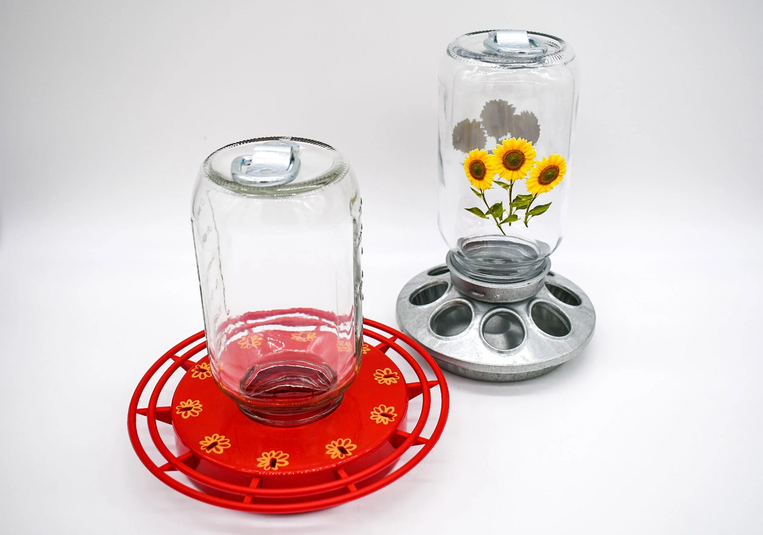 Plain and sunflower 32 oz Mason jars shown with compatible hummingbird and chicken feeder bases