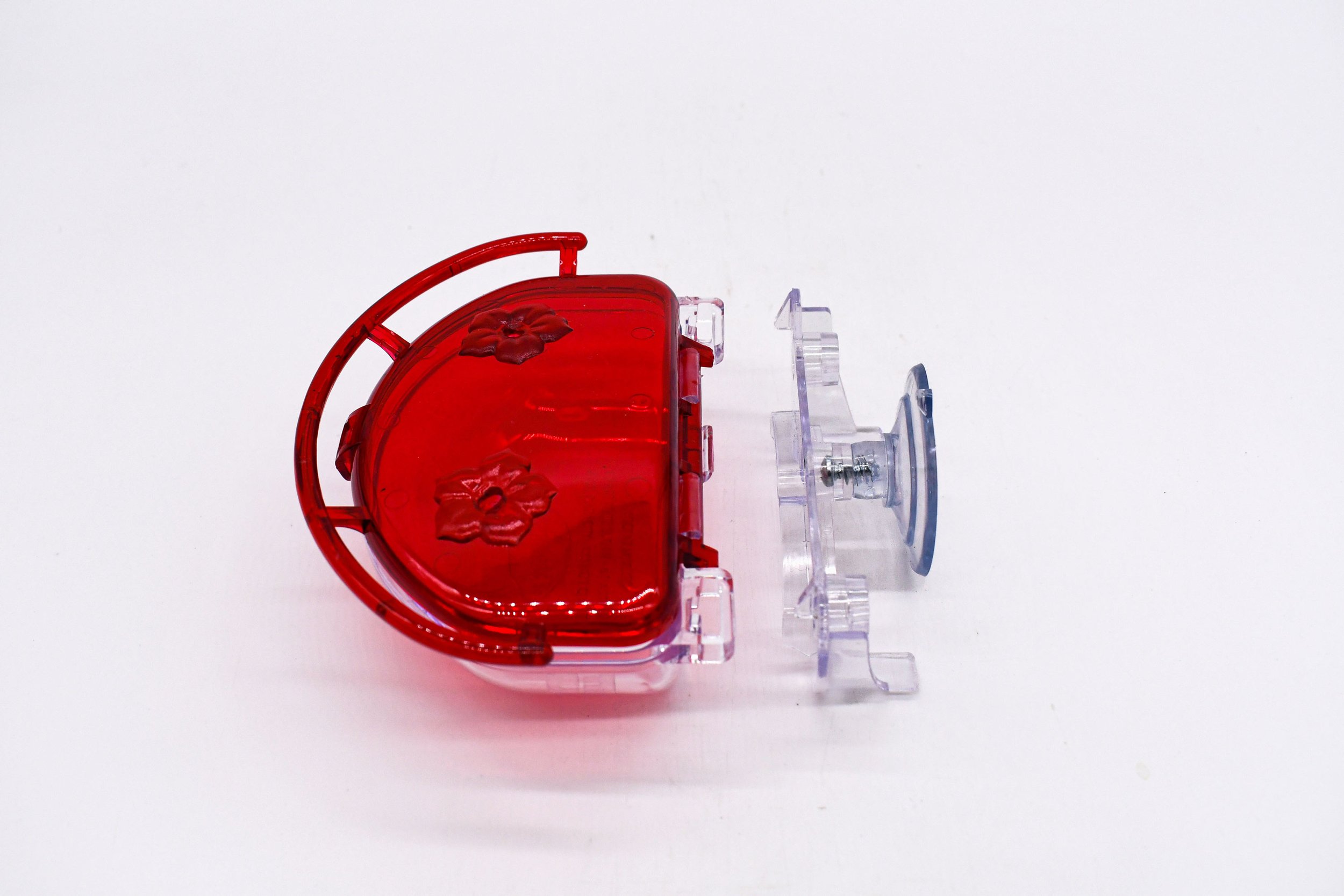 Side profile of the Aspects The Gem 4 oz Window Hummingbird Feeder showing the clear mounting bracket, suction cup, and durable polycarbonate construction.