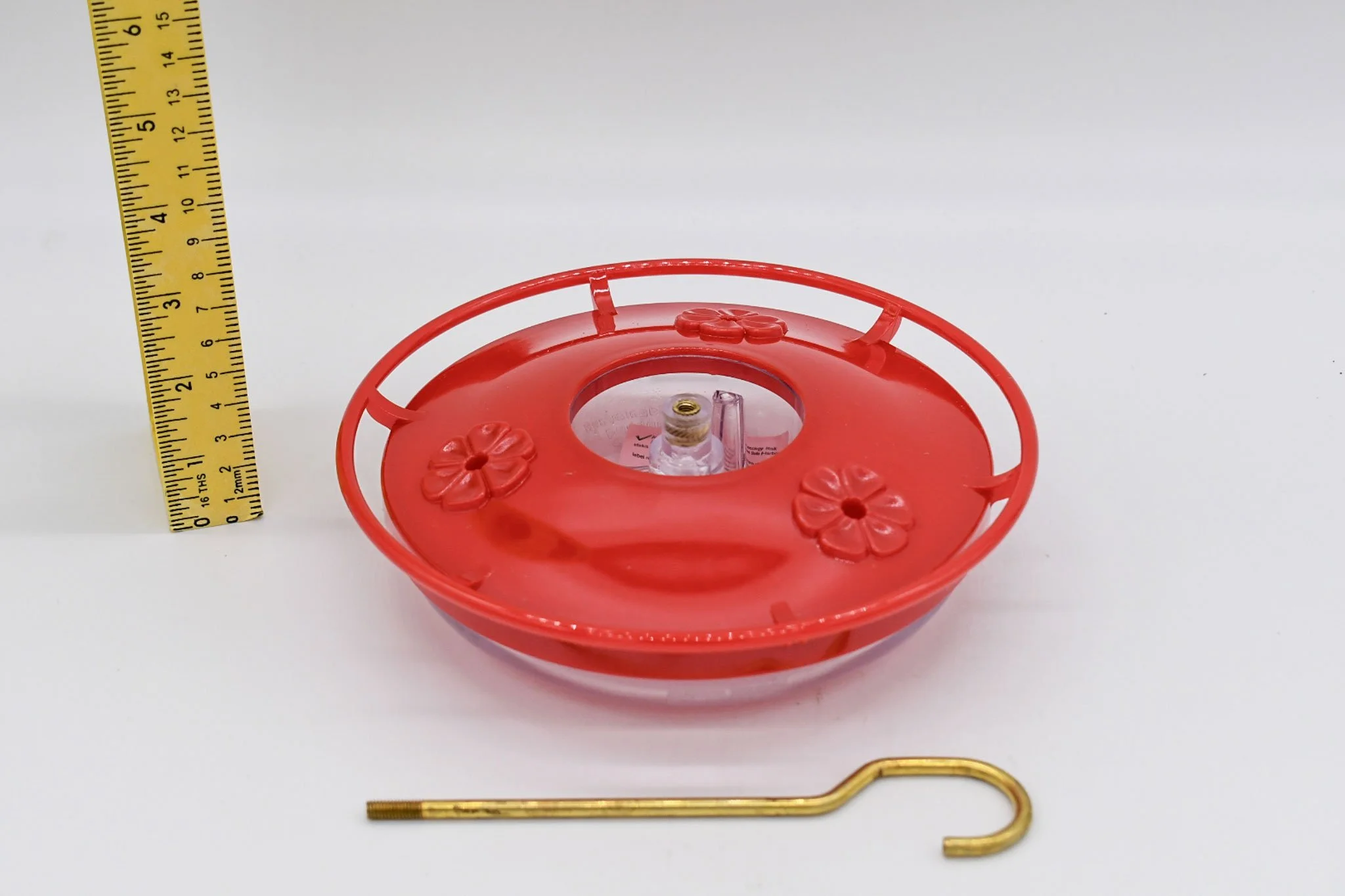 Low-angle view of the Aspects HighView Mini feeder showing the raised flower ports and hanging rod.