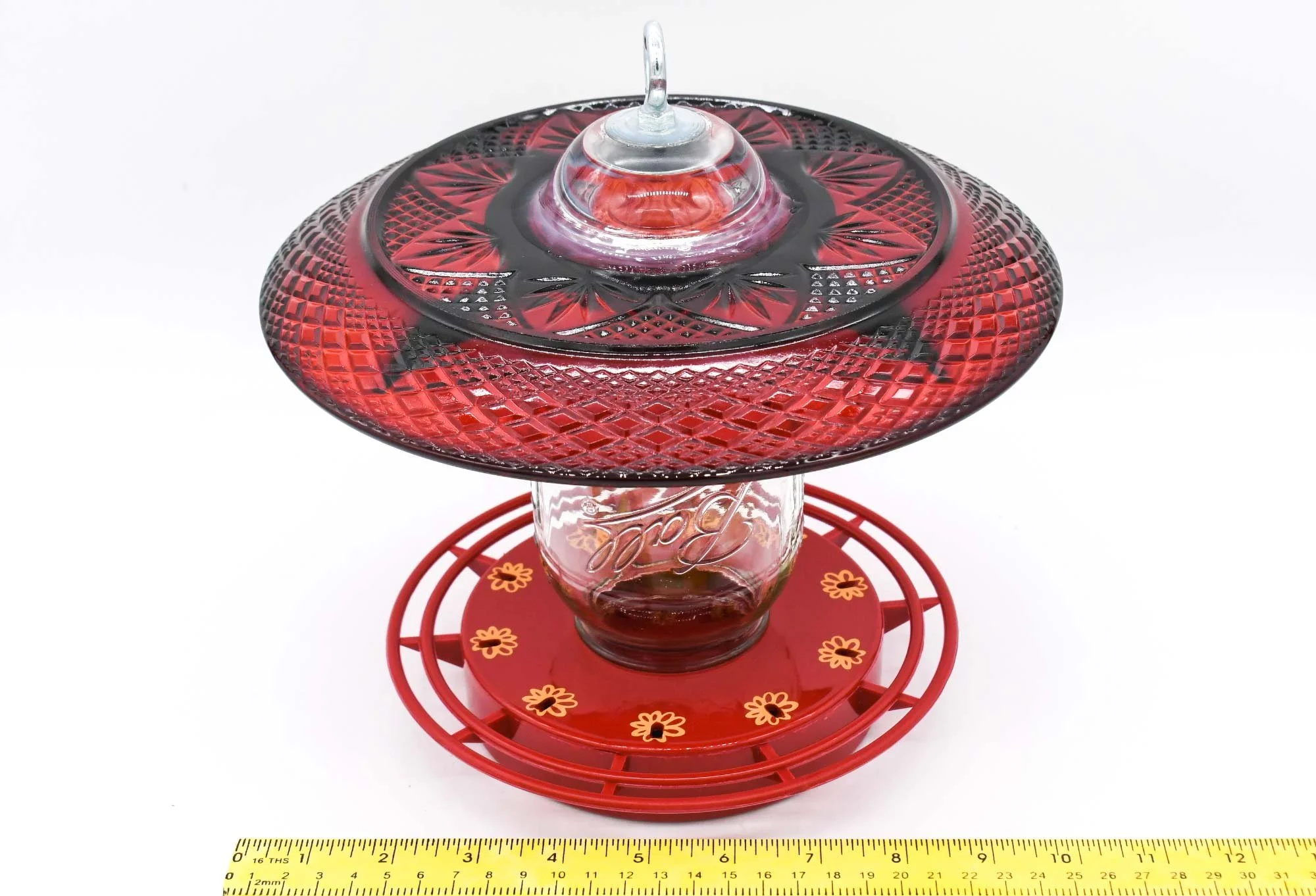 View of feeder with measuring tape showing width