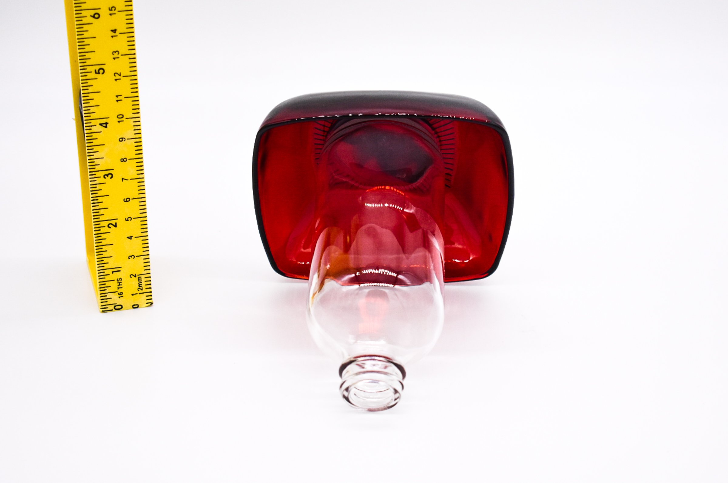 Bottom Up view of the 8 oz clear feeder bottle and underside of the Ruby Red Anchor Hocking Berry Bowl.