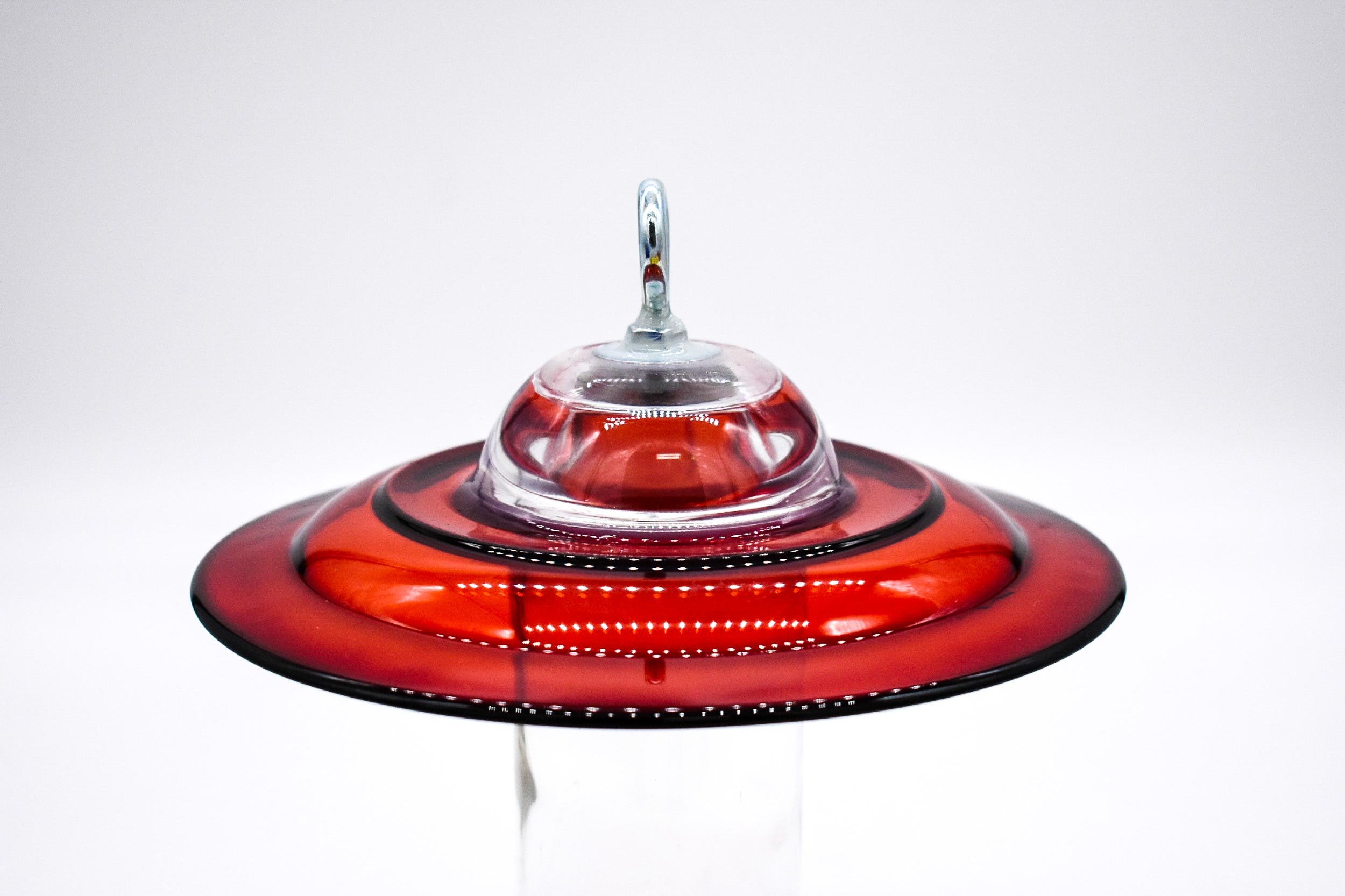 Side view of Red Anchor Hocking Feeder with Candle Votive Drilled with eye bolt installed.