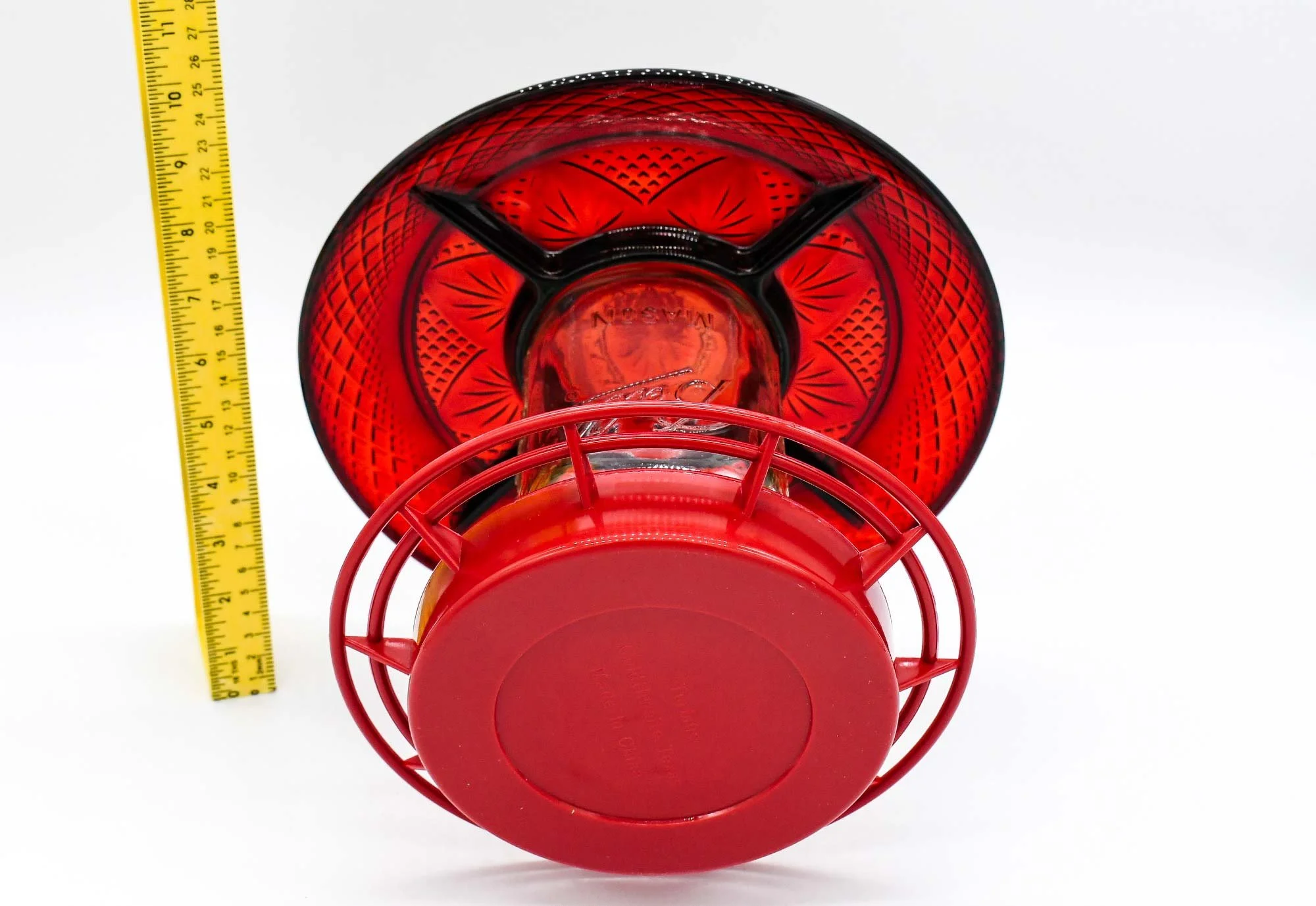 Ruby red glass with measuring tape showing size of glass plate