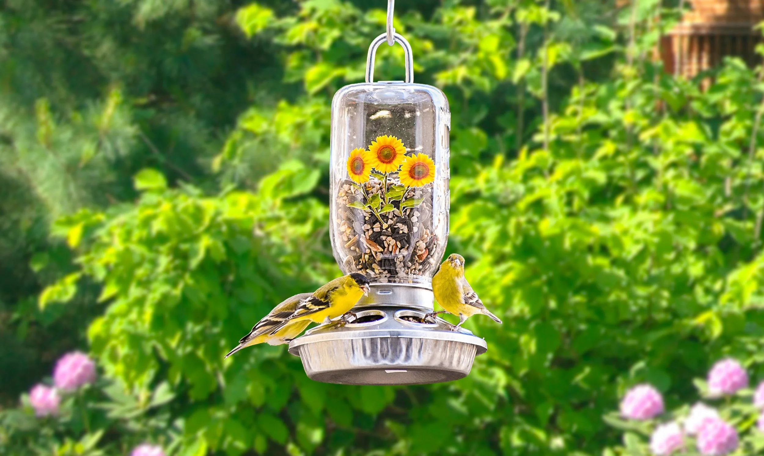 32 oz Mason jar hanging seed bird feeder with sunflower design and goldfinches feeding in a summer garden