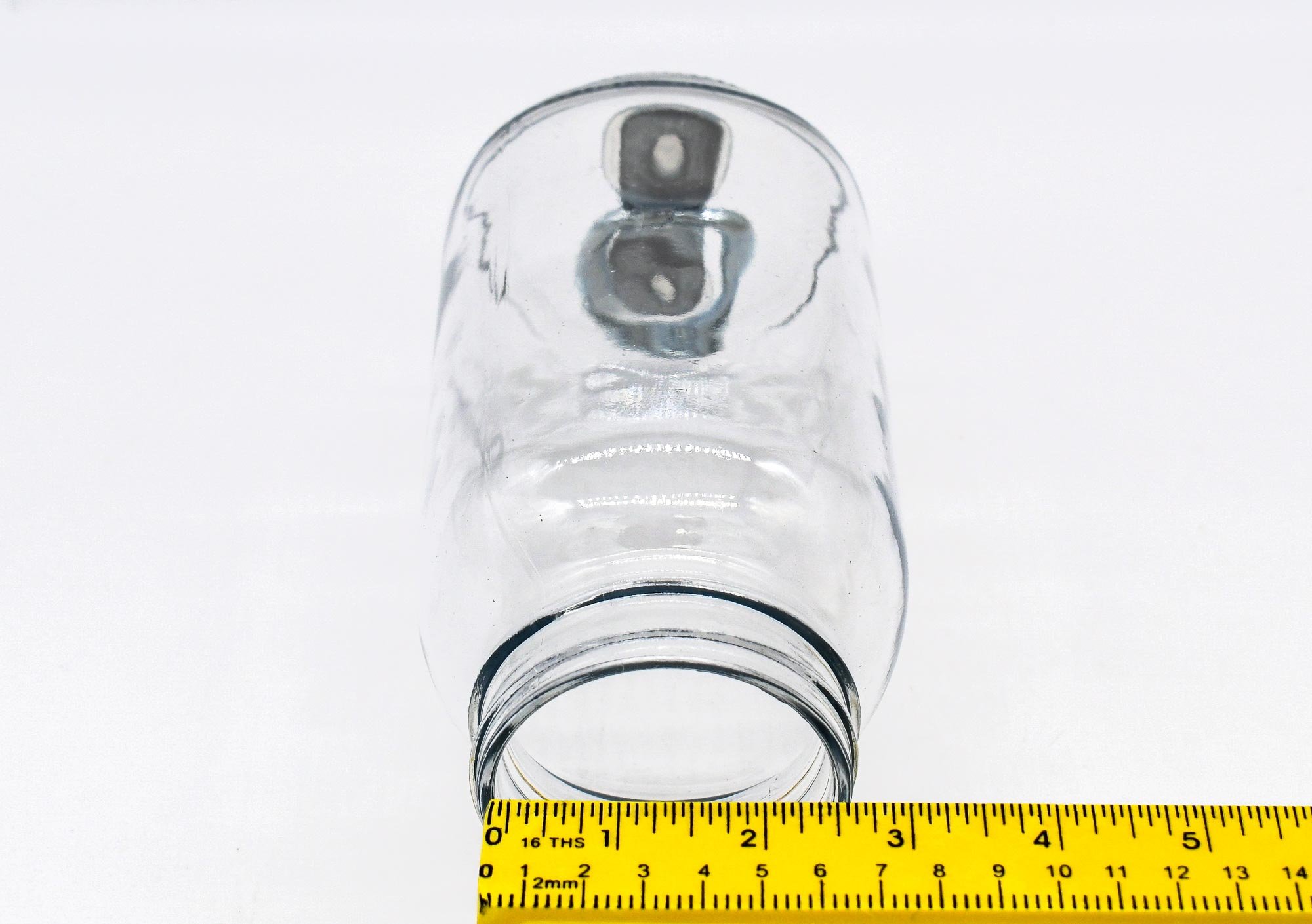 Farmhouse mason jar on its side measuring opening