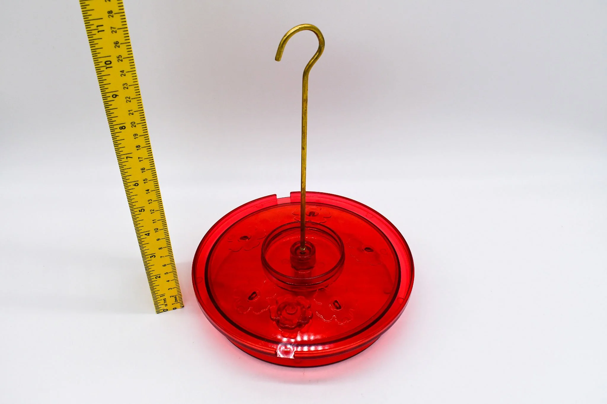 Overhead view of the Hummingbird Haven feeder showing five feeding ports and the wraparound perch.
