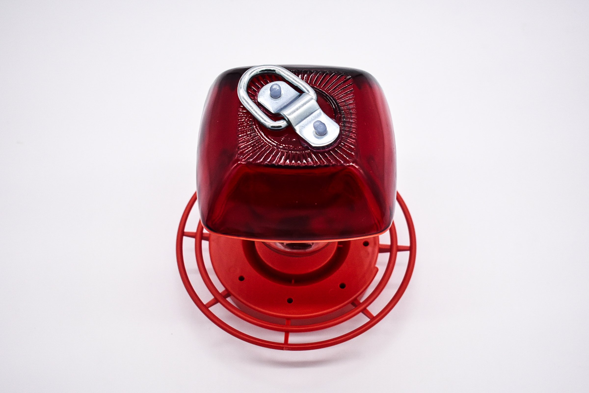 Top Down view of the Anchor Hocking Ruby Red Berry Bowl glass with 8oz reservoir and red Best 1 plastic hummingbird feeder on a white background.