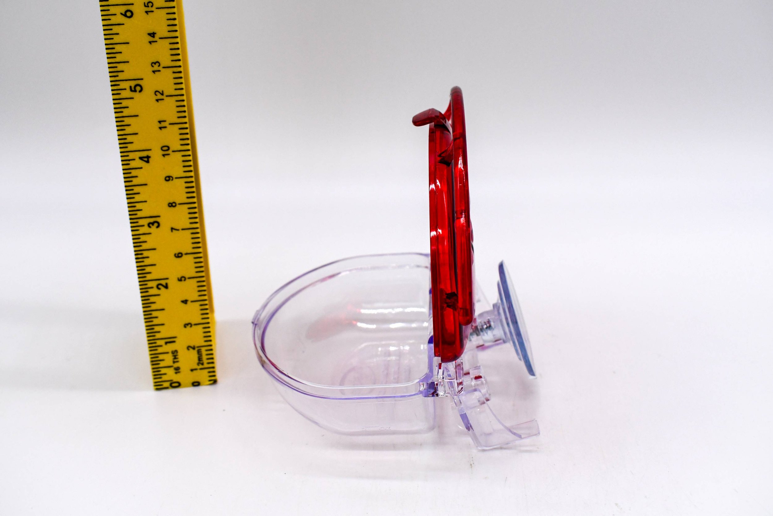 ide profile of the Aspects The Gem 4 oz Window Hummingbird Feeder with the hinged lid open, showing the clear nectar reservoir and suction cup mounting system.