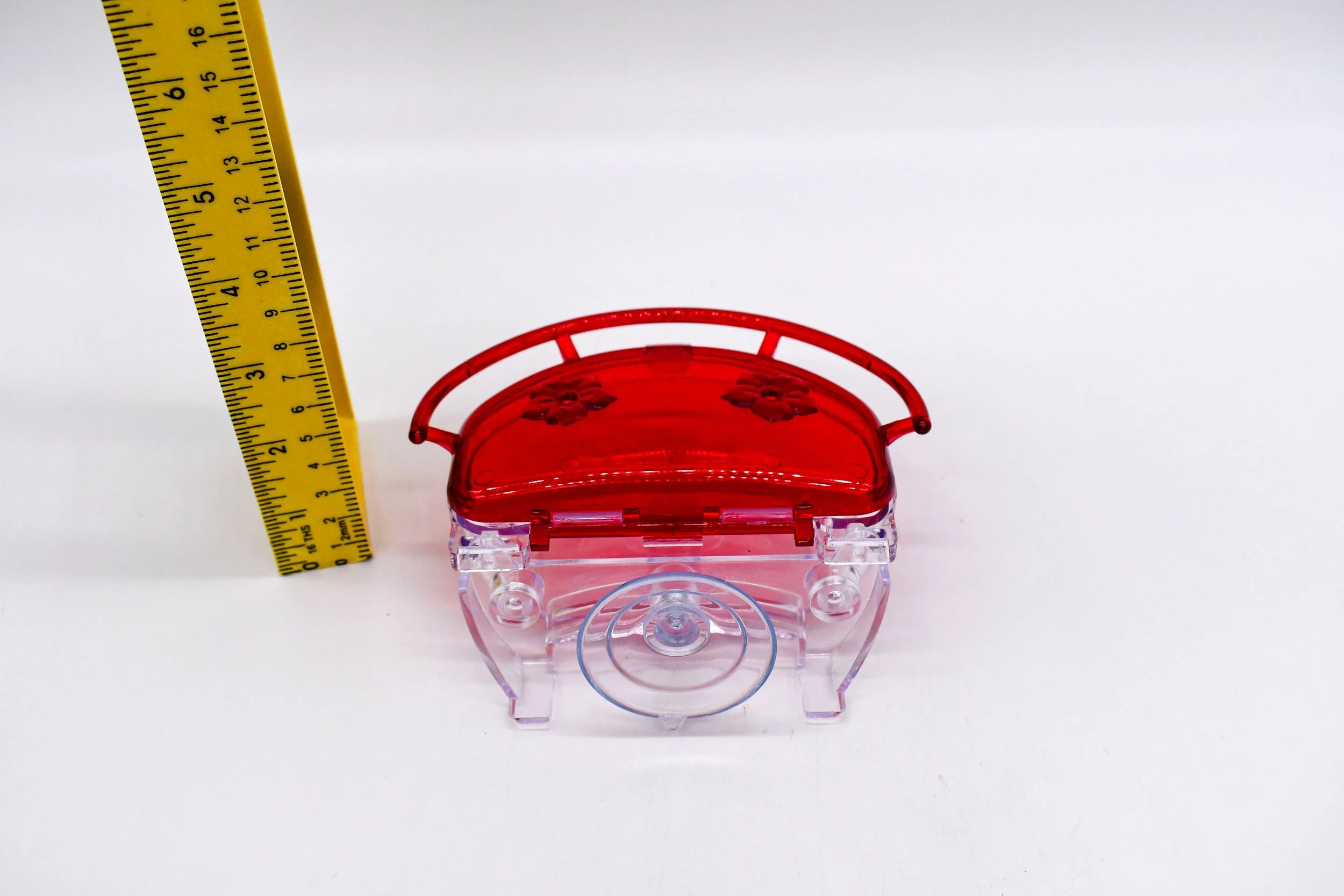 Front view of the Aspects The Gem 4 oz Window Hummingbird Feeder with measuring tape showing overall height for size reference.