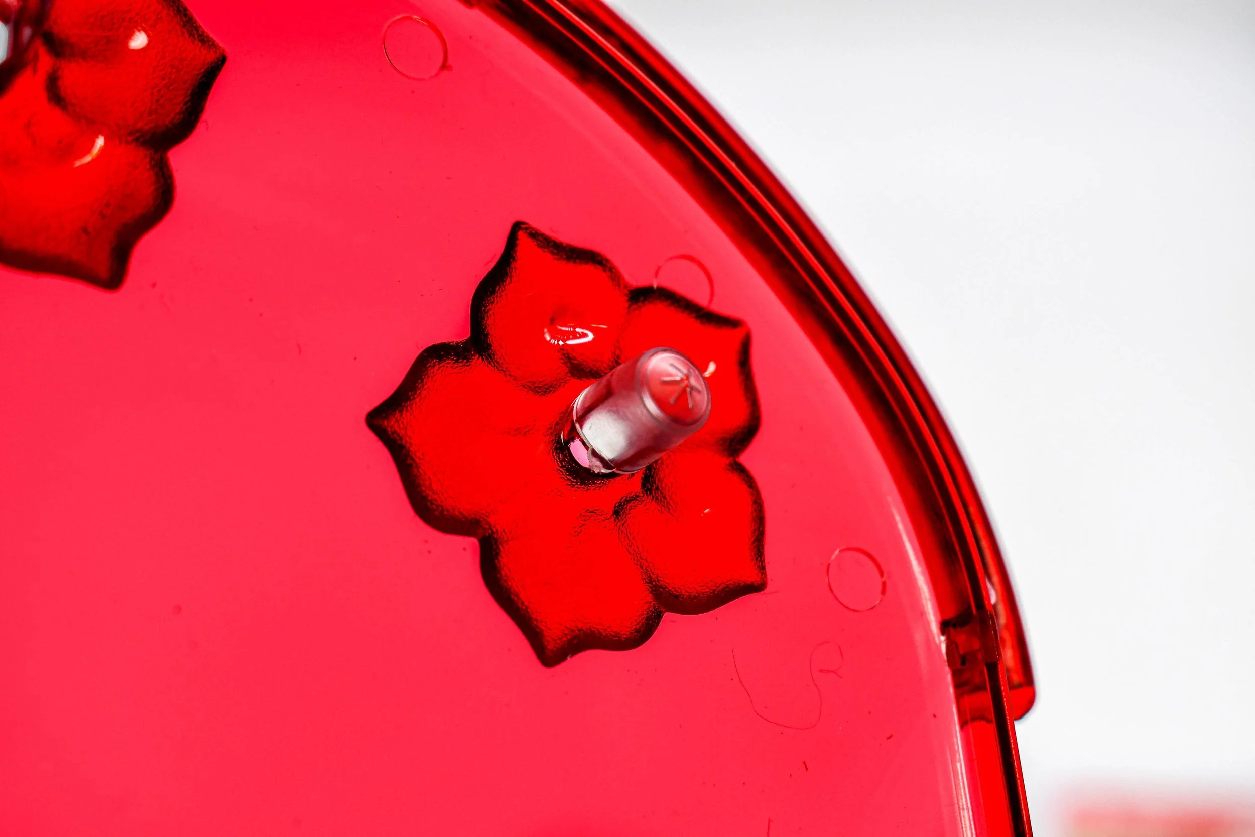 Aspects 384 Nectar Guard Tip installed inside a hummingbird feeder flower port to help deter insects