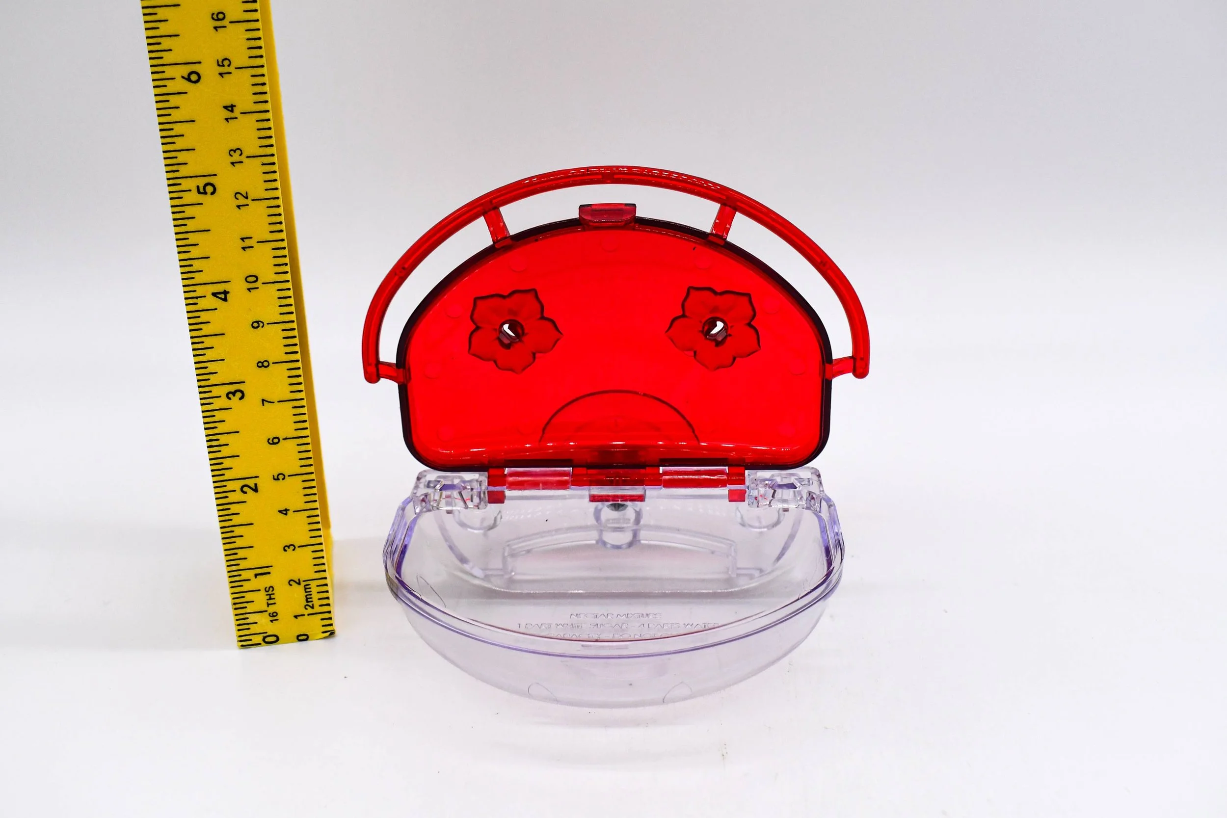 Front view of the Aspects The Gem 4 oz Window Hummingbird Feeder with dual feeding ports and integrated perch. Made in the USA for close-up hummingbird viewing.