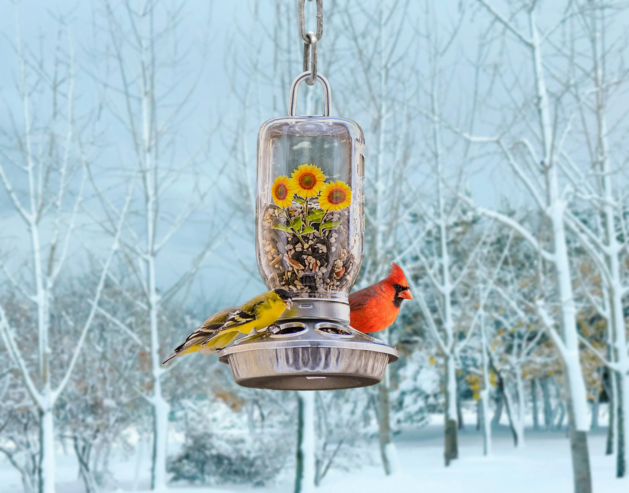 Handmade 32 oz Mason jar hanging bird feeder with sunflower design, cardinal and goldfinch in a snowy winter setting