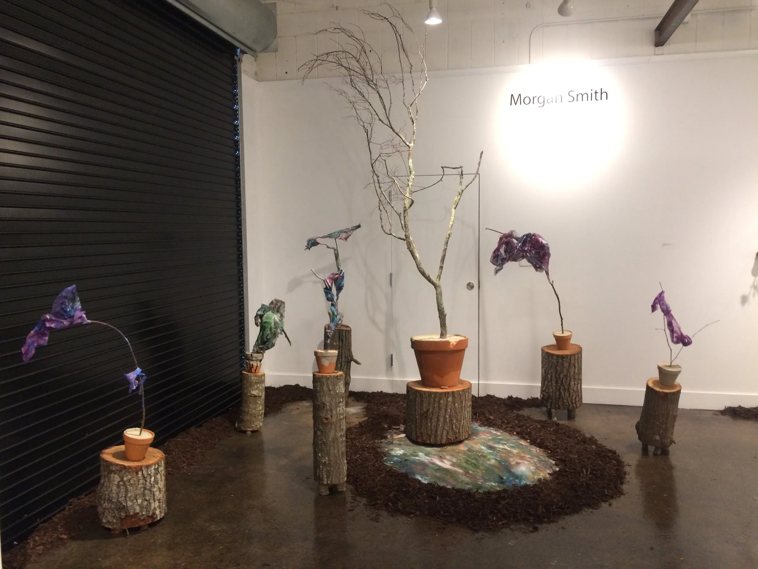   A Walk Through , branches, cement, acrylic paint, braid, clay pots, found debris, wood mulch, 6’x6’x10', 2017 
