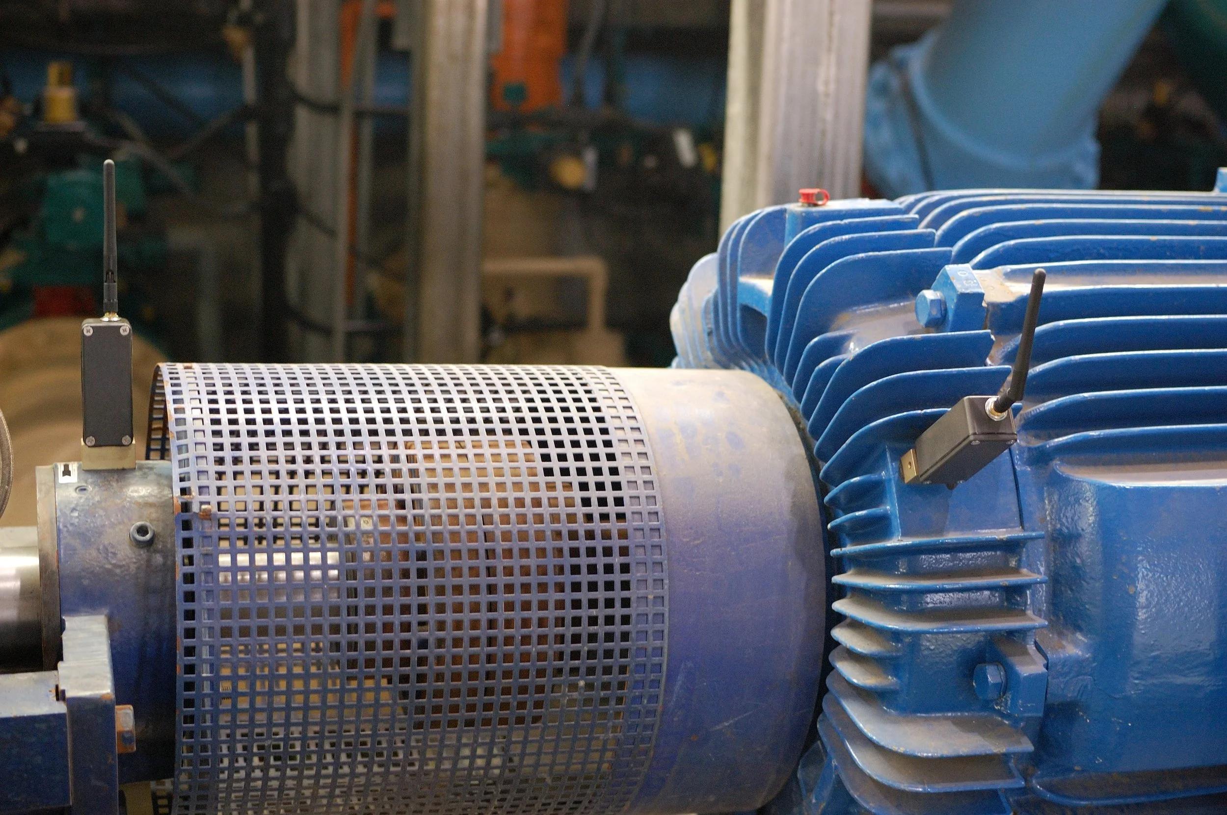 SmartHAWK wireless vibration and temperature sensors installed on a motor at a water treatment facility.