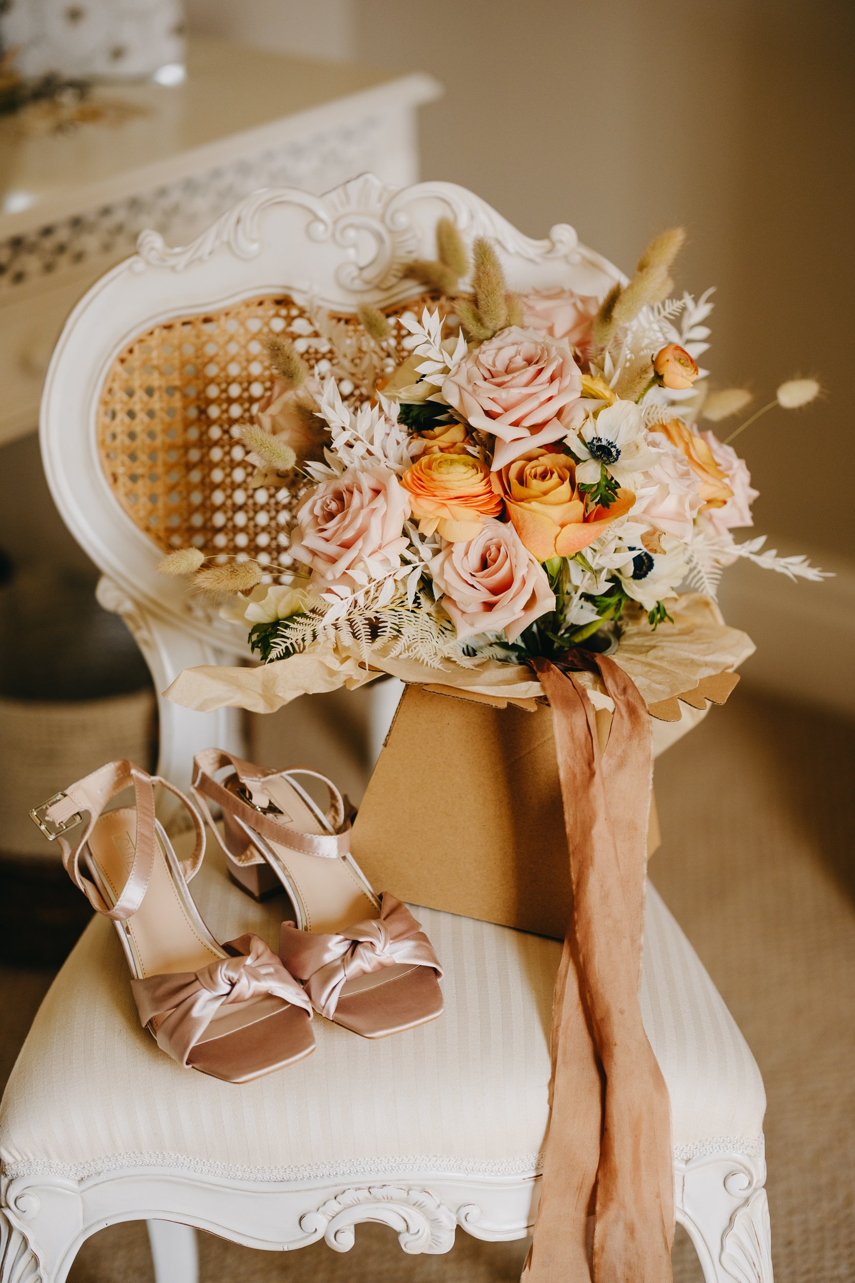 Bridal shoes and flowers at Thirsk Lodge Barn