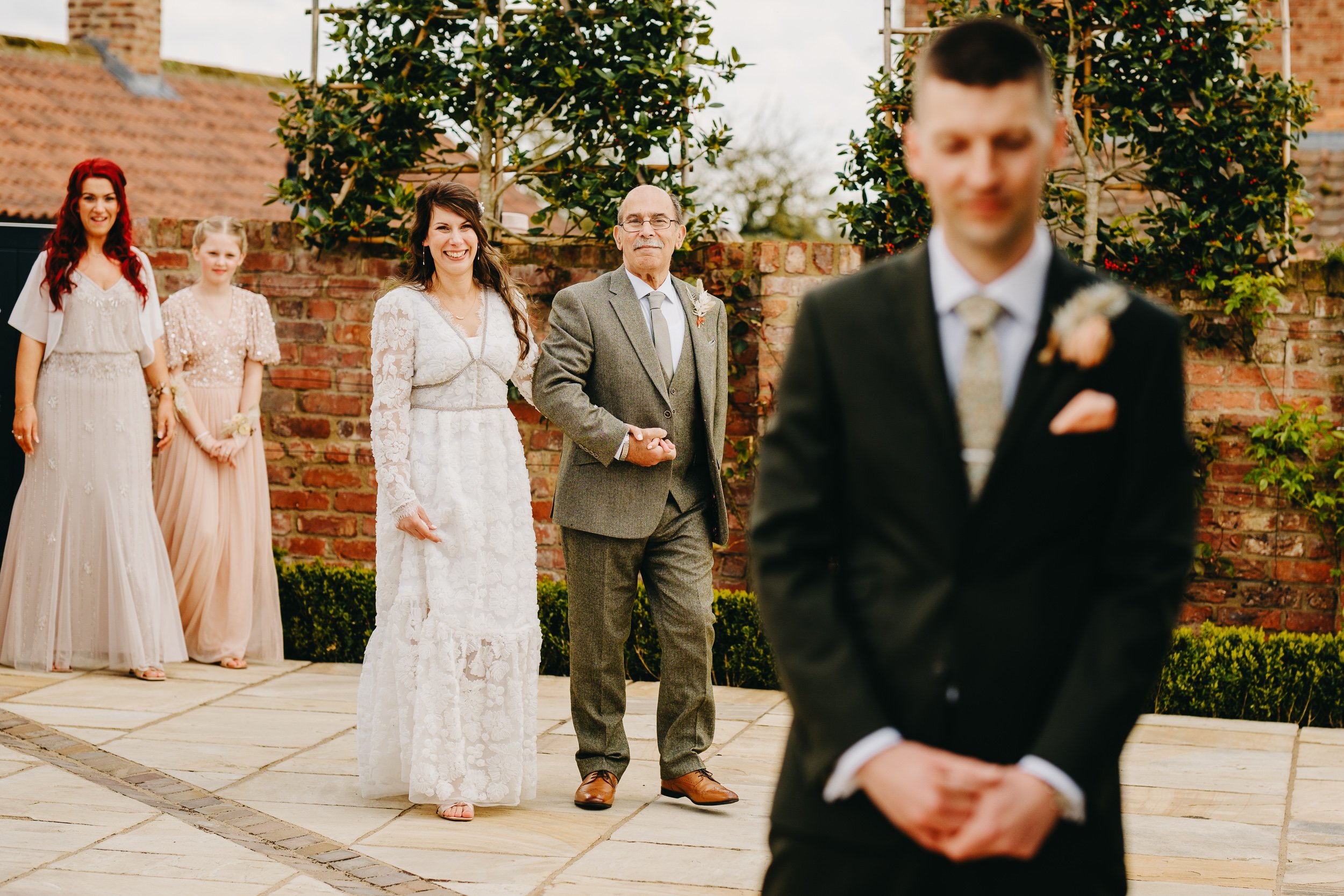 First look between bride and groom at Thirsk Lodge Barns