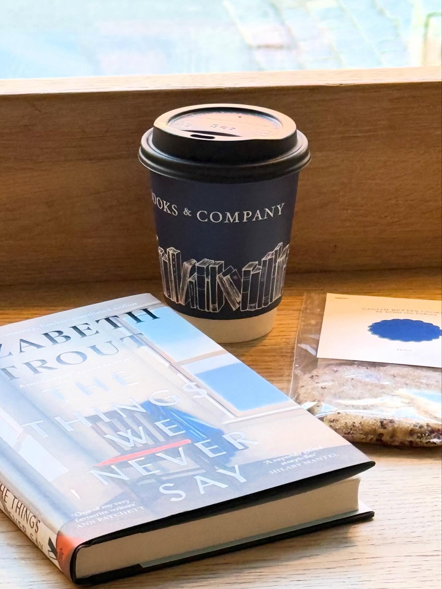 Wishing you a wonderful ☀️y Friday with this absolutely perfect (late) morning set. 

A delicious coffee from your favorite local bookshop, a new amazing cookie from @juno_the_bakery, and the highly anticipated, highly praised new novel by @lizstrout